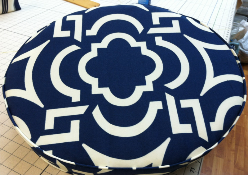 Round pillow, white geometric pattern on blue background
