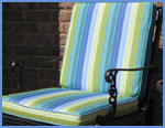 Wrought iron chair covered with colorful Sunbrella fabric