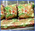 Outdoor bench with colorful pillows and seat cushion