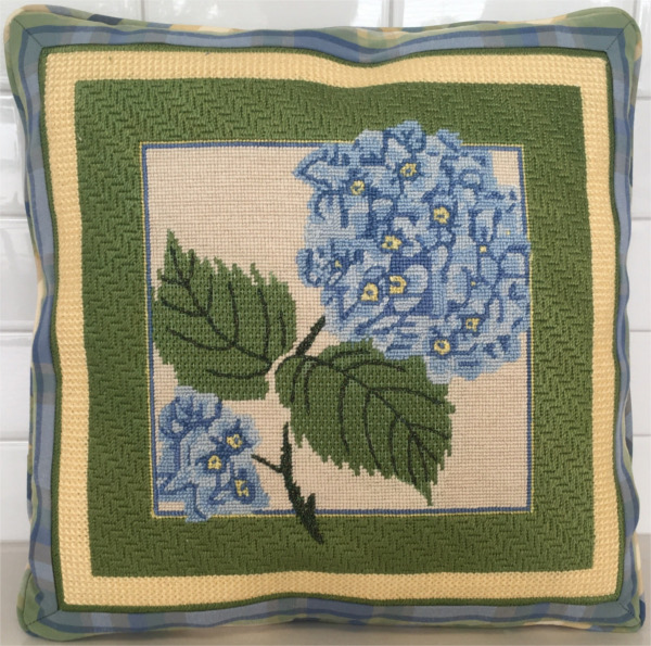 Embroidered blue hydrangea and leaves with green border on square pillow