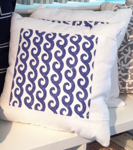 Throw pillows with contrasting center of patterned fabric in a perfect square