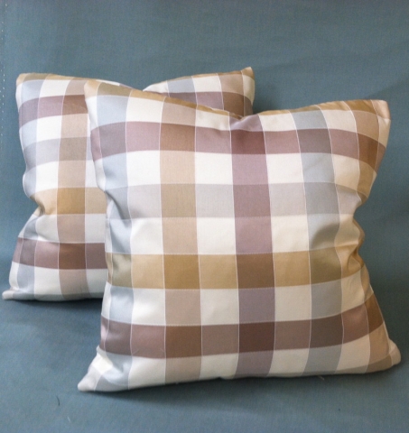 Two perfectly matching throw pillows of large checked pattern