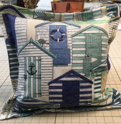 Square throw pillow with deep stitched edges