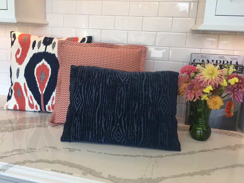 Three throw pillows with various details, showcasing the diversity of designs possible by SeaCheryl Designs