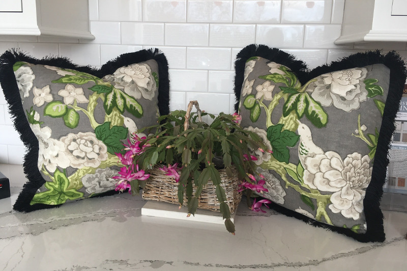 Perfectly matched patterned throw pillows with thick thread edging