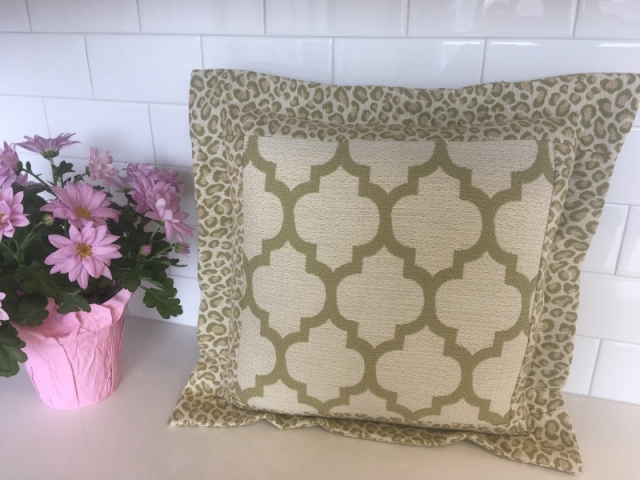 Square throw pillow with two fabrics