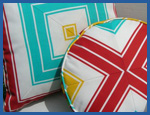 Geometric patterned fabric on round and square pillow